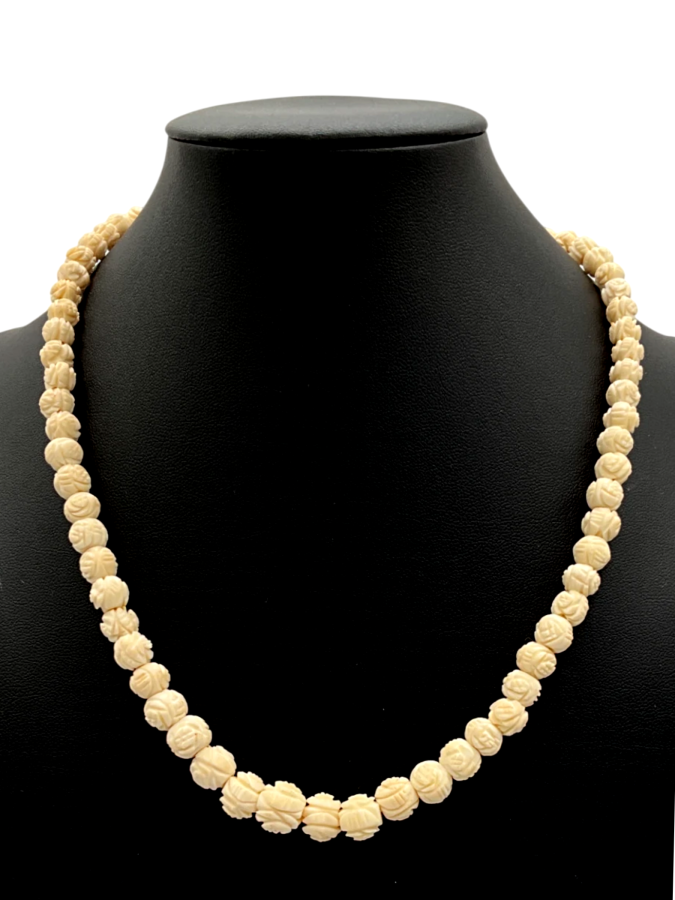 Hand-carved necklace