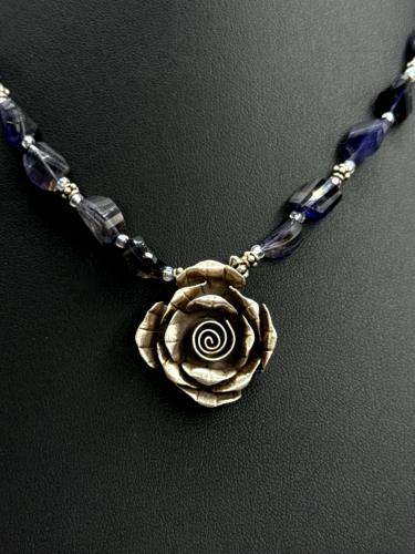 Carved flowers pendant