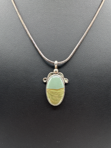 Oval asymmetrical pendant