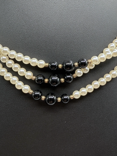 Black and white pearl statement rope necklace