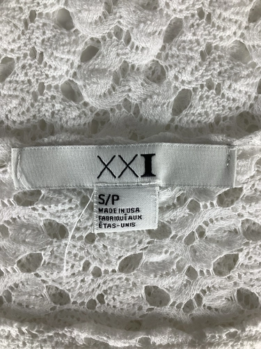 XXI